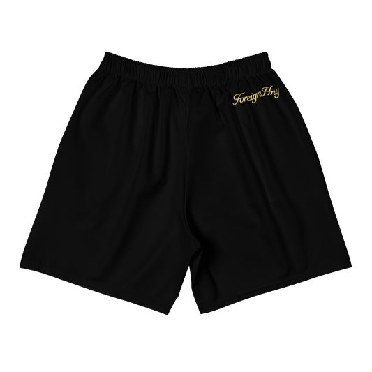Black shorts with 'Foreigner' logo on a white background