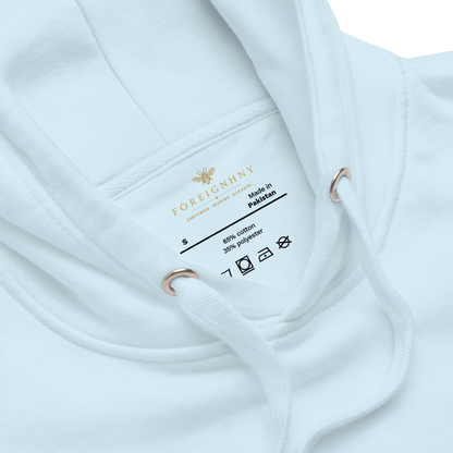 Close-up of a white garment with a label on a white background