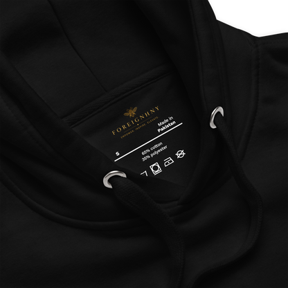Close-up of a black garment label with brand name and details.