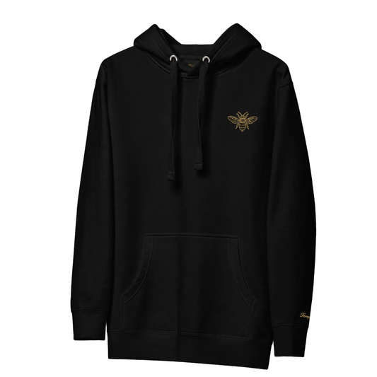 Black hoodie with a gold bee emblem on a black background